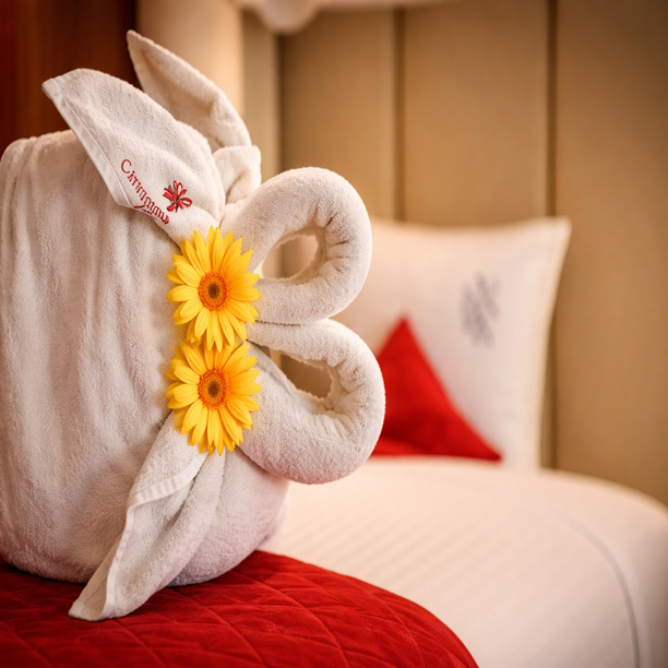 Beautiful towel decoration on bed in hotel room