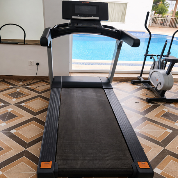 Modern gym facility with treadmill at Thai Beach Resort